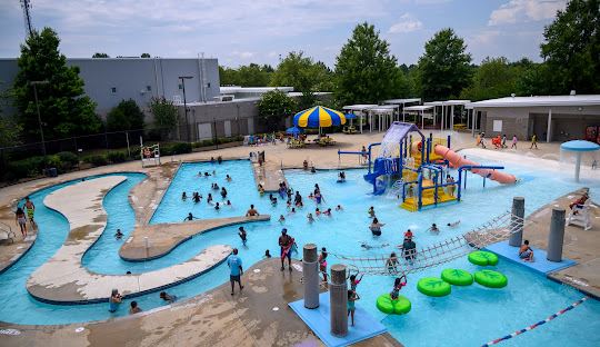Aquatic center with lazy river and water play structures